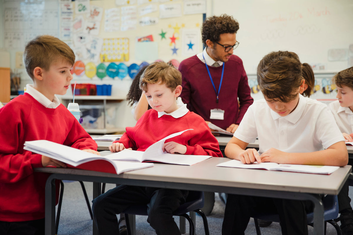 Children working at desks in a classroom