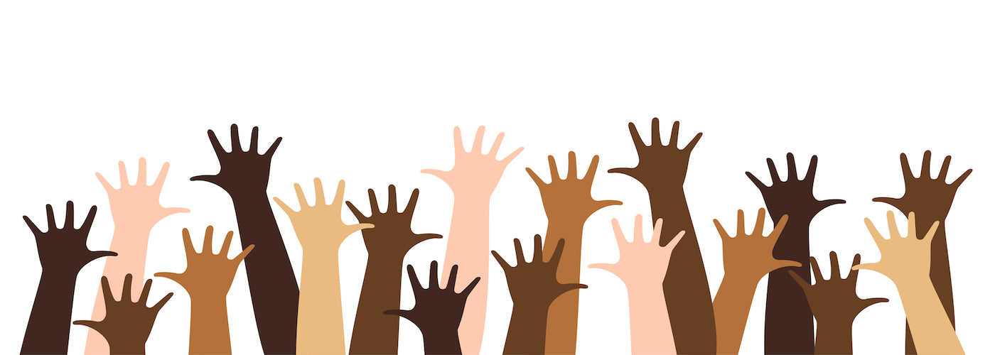Multi cultural hands raised up