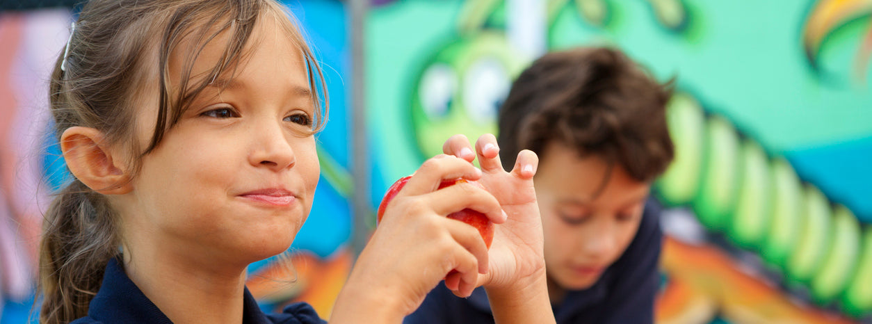 A child enjoying eating in school