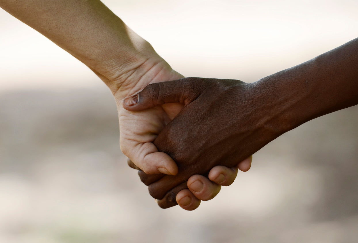 Ruby Bridges Facts two people of different races holding hands